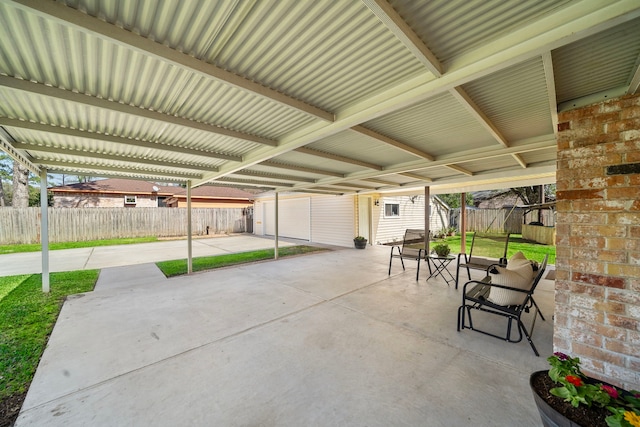 19210 Lockridge Dr, Spring, TX 77373 - view of patio with fence and an outbuilding