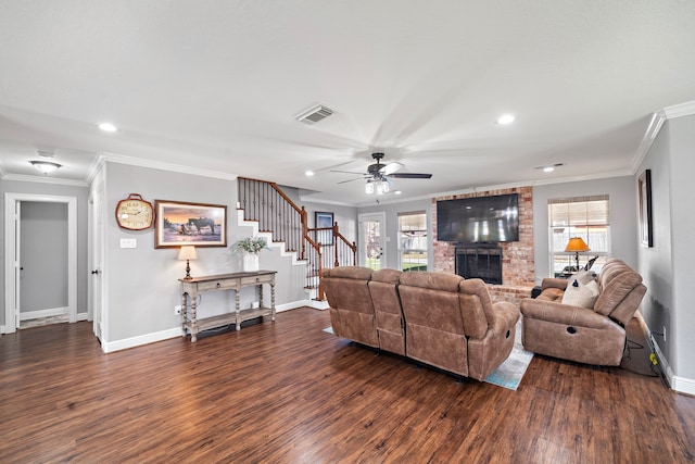 living room featuring stairs, a wealth of natural light, ornamental molding, and visible vents