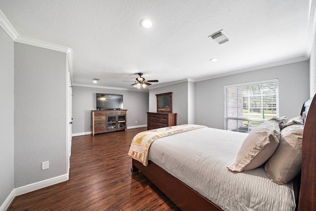 bedroom with dark wood finished floors, visible vents, ornamental molding, a textured ceiling, and baseboards