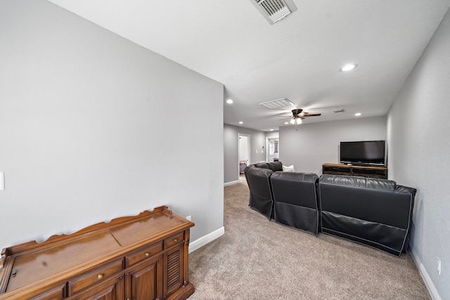 living room featuring baseboards, visible vents, and light colored carpet