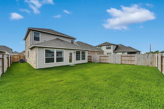 715 Whispering Winds Dr, Beasley, TX 77417 - back of house featuring central AC and roof with shingles
