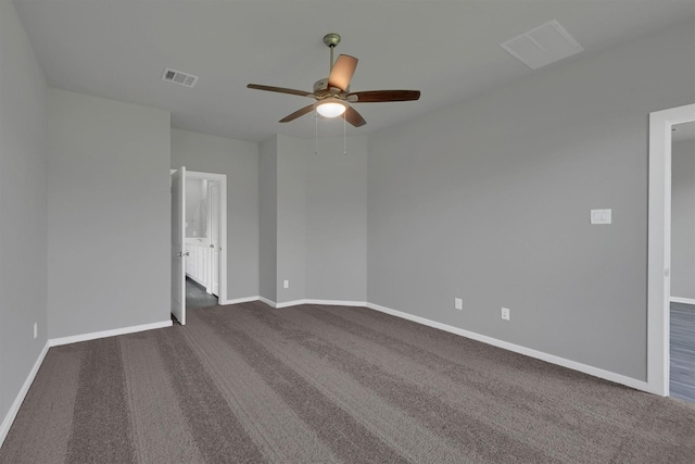 715 Whispering Winds Dr, Beasley, TX 77417 - unfurnished room with a ceiling fan, dark carpet, and baseboards