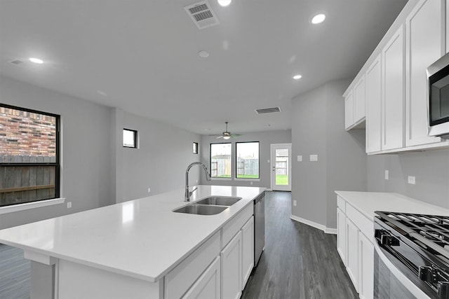 715 Whispering Winds Dr, Beasley, TX 77417 - kitchen featuring a sink, dark wood-style floors, ceiling fan, white cabinets, and recessed lighting