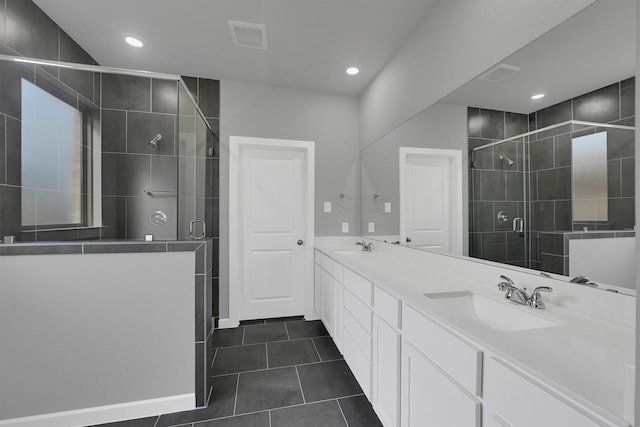 715 Whispering Winds Dr, Beasley, TX 77417 - full bath with double vanity, a shower stall, tile patterned flooring, and recessed lighting