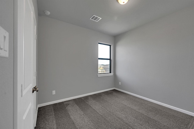 715 Whispering Winds Dr, Beasley, TX 77417 - spare room featuring dark carpet, a smoke detector, and baseboards