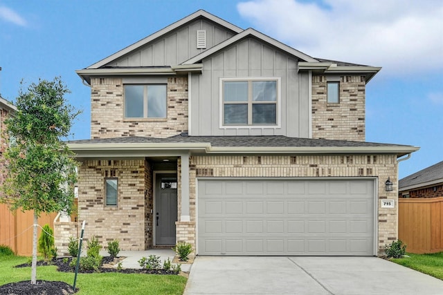 715 Whispering Winds Dr, Beasley, TX 77417 - view of front facade with driveway, board and batten siding, brick siding, and an attached garage