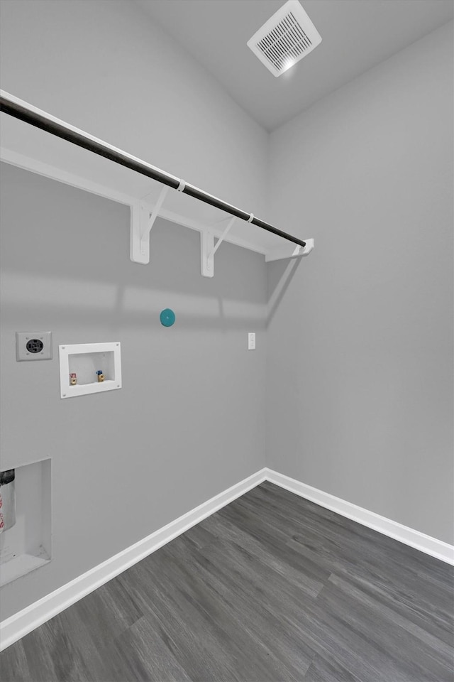 715 Whispering Winds Dr, Beasley, TX 77417 - washroom with hookup for a washing machine, electric dryer hookup, dark wood-style floors, and baseboards