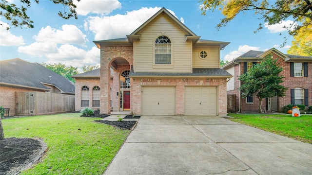 traditional-style house with a garage, driveway, fence, a front lawn, and brick siding