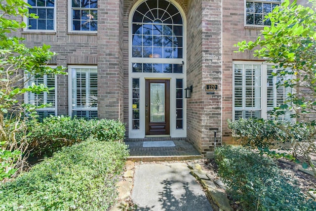 entrance to property with brick siding