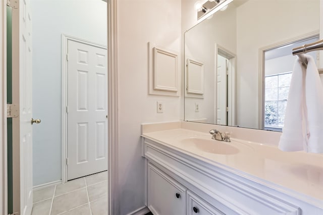 bathroom with tile patterned flooring and vanity