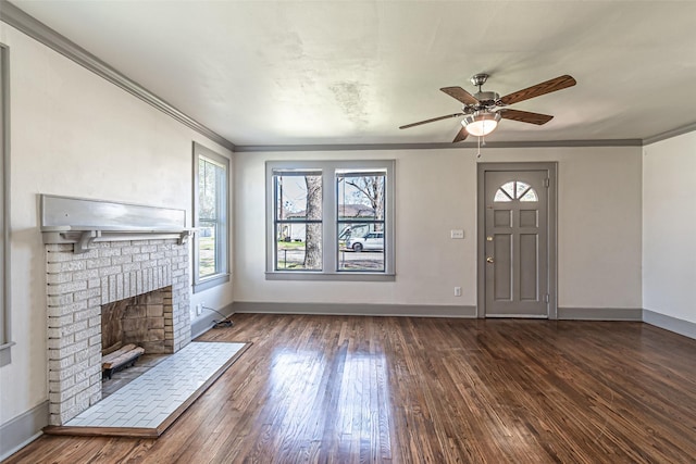 unfurnished living room with ornamental molding, a fireplace, and wood finished floors