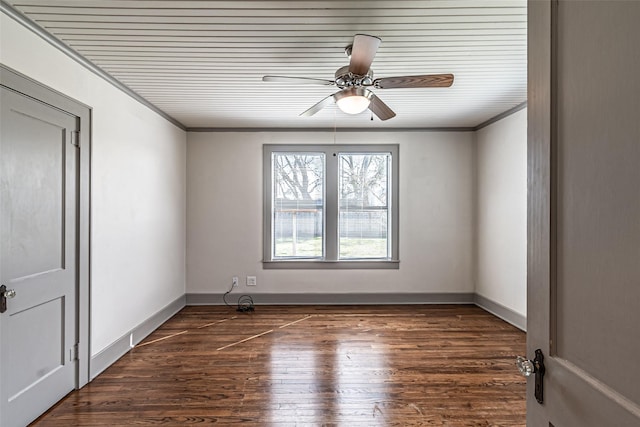 spare room featuring ornamental molding, ceiling fan, baseboards, and wood finished floors