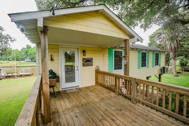 wooden terrace with a yard