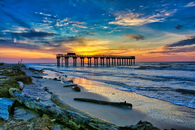 view of water feature with a pier and a beach view