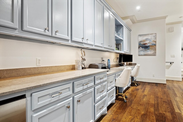 office with dark wood-style floors, baseboards, and built in study area