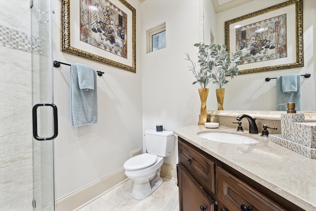 full bath featuring a stall shower, vanity, toilet, and baseboards