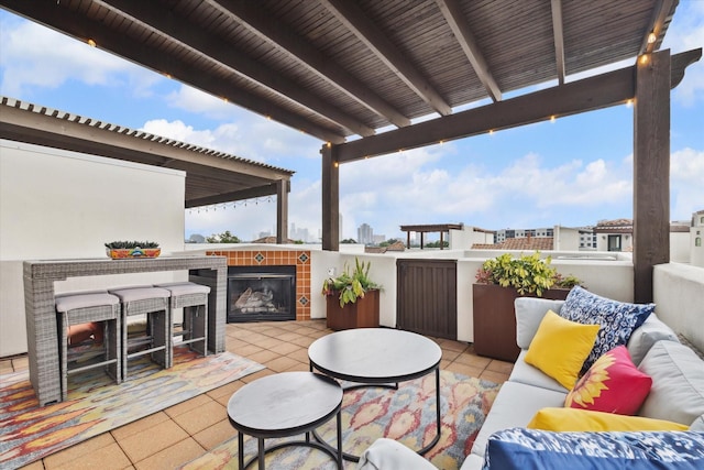 view of patio featuring an outdoor living space with a fireplace