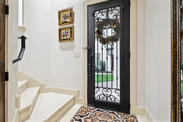 foyer featuring stairs