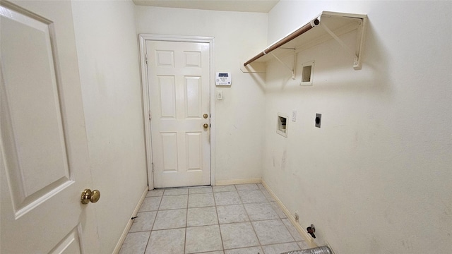 clothes washing area featuring washer hookup, light tile patterned floors, electric dryer hookup, laundry area, and baseboards