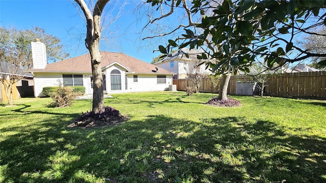 view of yard with a fenced backyard