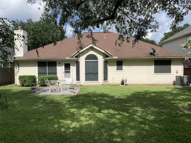 back of property featuring a yard, central AC, fence, and a patio