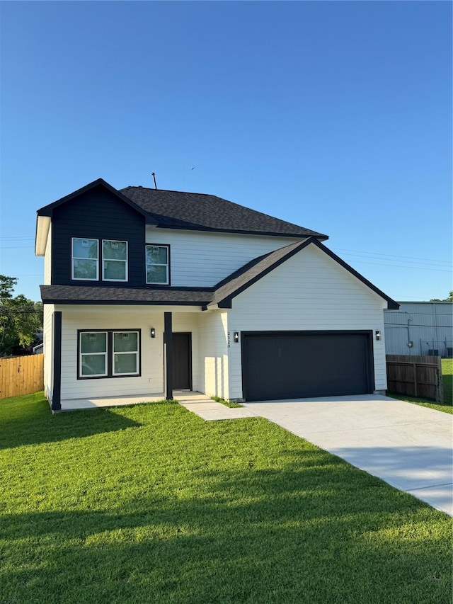 view of front of house featuring driveway, fence, a garage, roof with shingles, and a front lawn