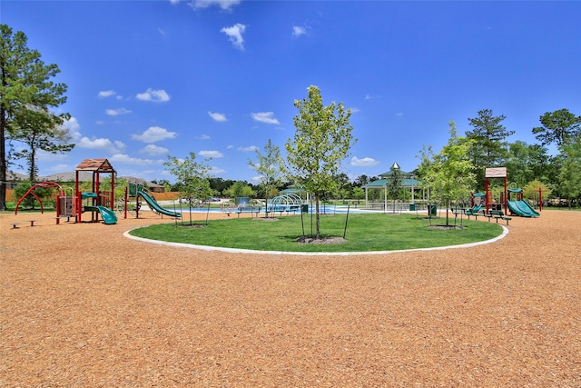 community play area with a lawn