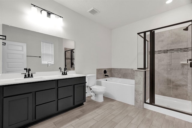 bathroom with a sink, visible vents, and a shower stall