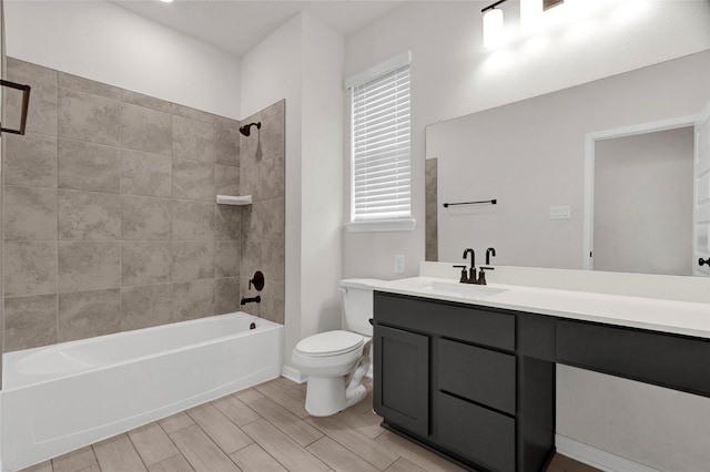 bathroom featuring toilet, vanity,  shower combination, and wood tiled floor