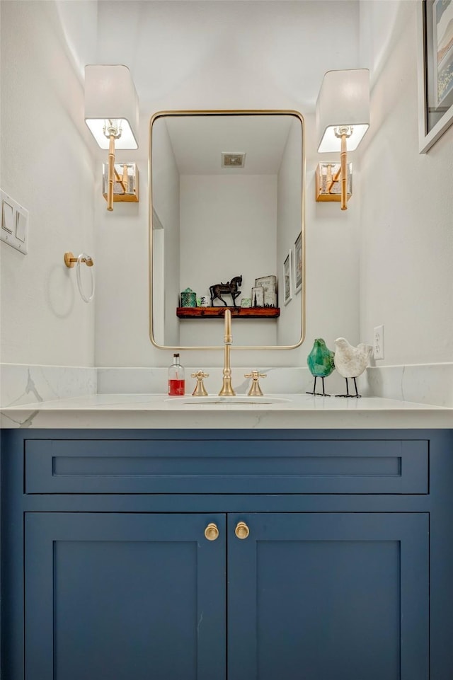 bathroom featuring visible vents and vanity