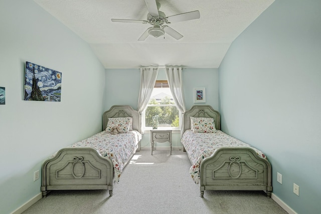 bedroom featuring baseboards, vaulted ceiling, and carpet flooring