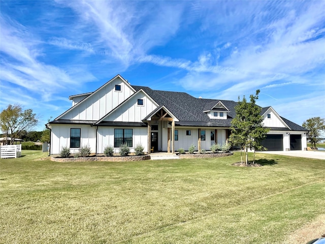 modern farmhouse style home with a garage, a shingled roof, driveway, board and batten siding, and a front yard