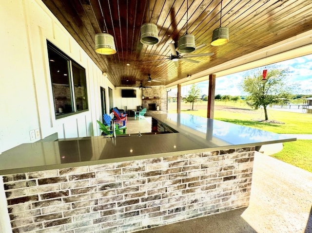 view of patio with ceiling fan and outdoor wet bar