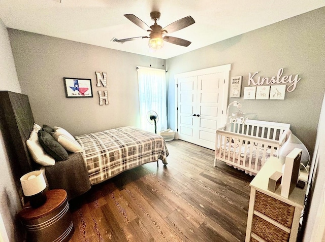 bedroom featuring a closet, ceiling fan, and wood finished floors