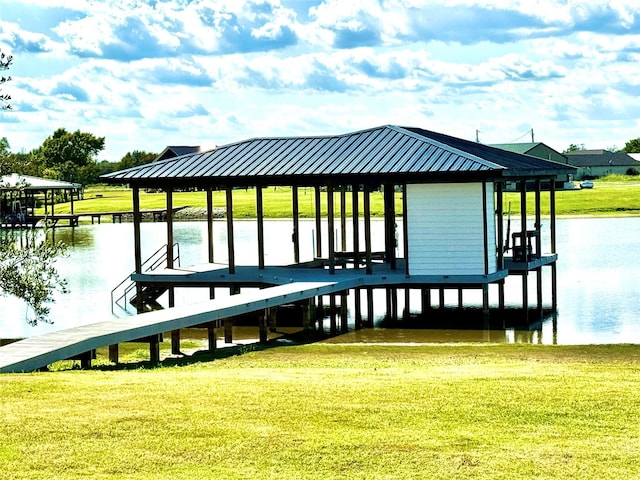 dock area featuring a water view and a yard