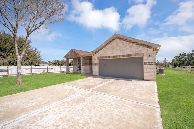 view of front of house featuring driveway, fence, central AC, and a front yard