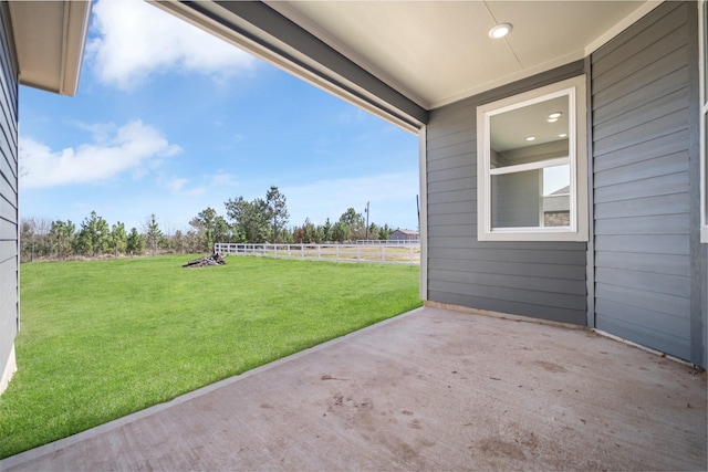 view of patio featuring fence