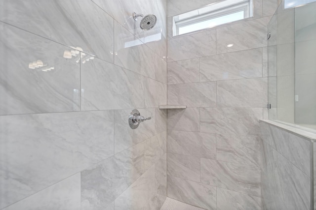 bathroom with tiled shower