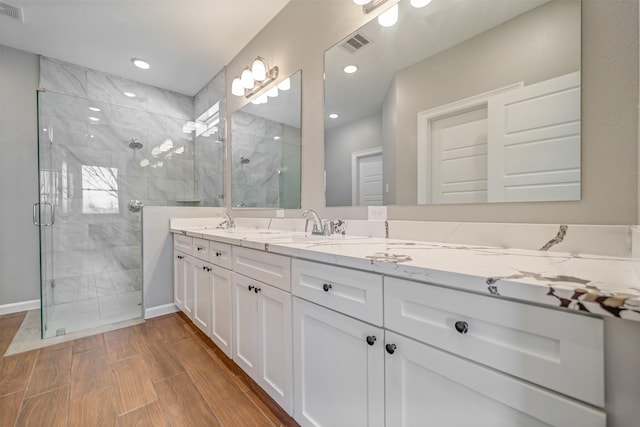 248 Alleda, Prairie View, TX 77484 - full bathroom with a stall shower, double vanity, and recessed lighting