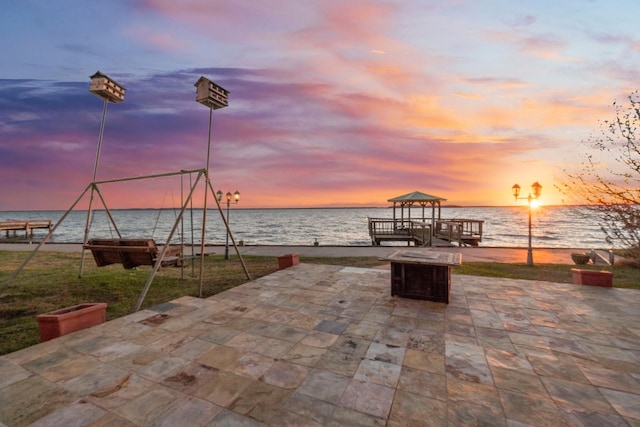 exterior space featuring a gazebo and a water view