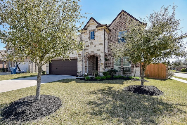 view of front facade featuring a garage, fence, stone siding, concrete driveway, and a front lawn