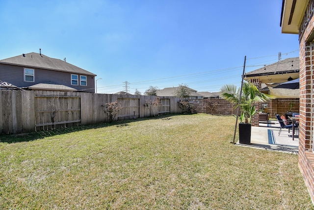 view of yard with a patio and a fenced backyard