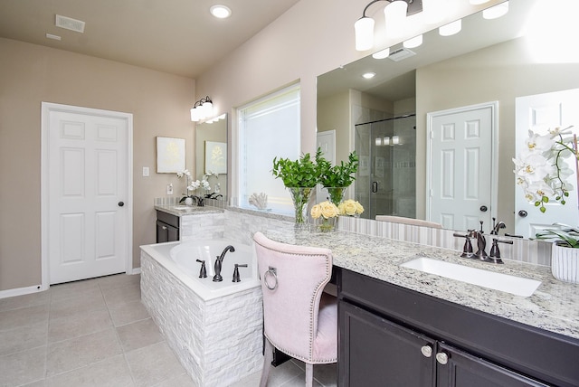 full bathroom featuring a garden tub, tile patterned flooring, vanity, visible vents, and a shower stall