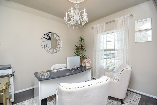 home office with an inviting chandelier, baseboards, and wood finished floors