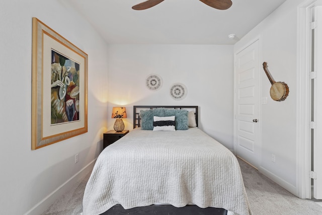 bedroom with ceiling fan, carpet flooring, and baseboards