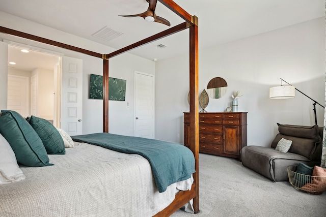 bedroom with light carpet, visible vents, and a ceiling fan