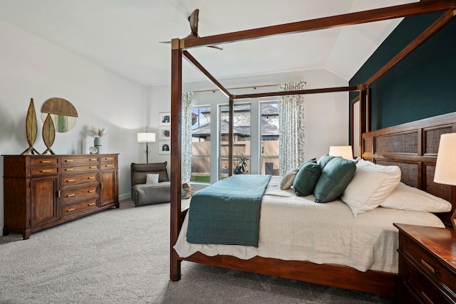 bedroom with ceiling fan, vaulted ceiling, and light colored carpet