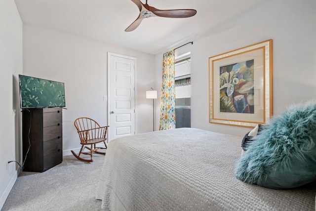 bedroom featuring carpet, baseboards, and a ceiling fan