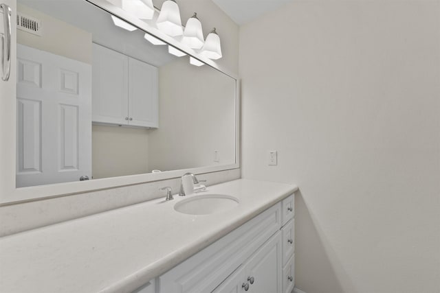 bathroom with visible vents and vanity