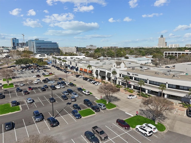 birds eye view of property with a view of city